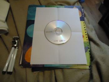 place-cd-dvd-in-center-of-page